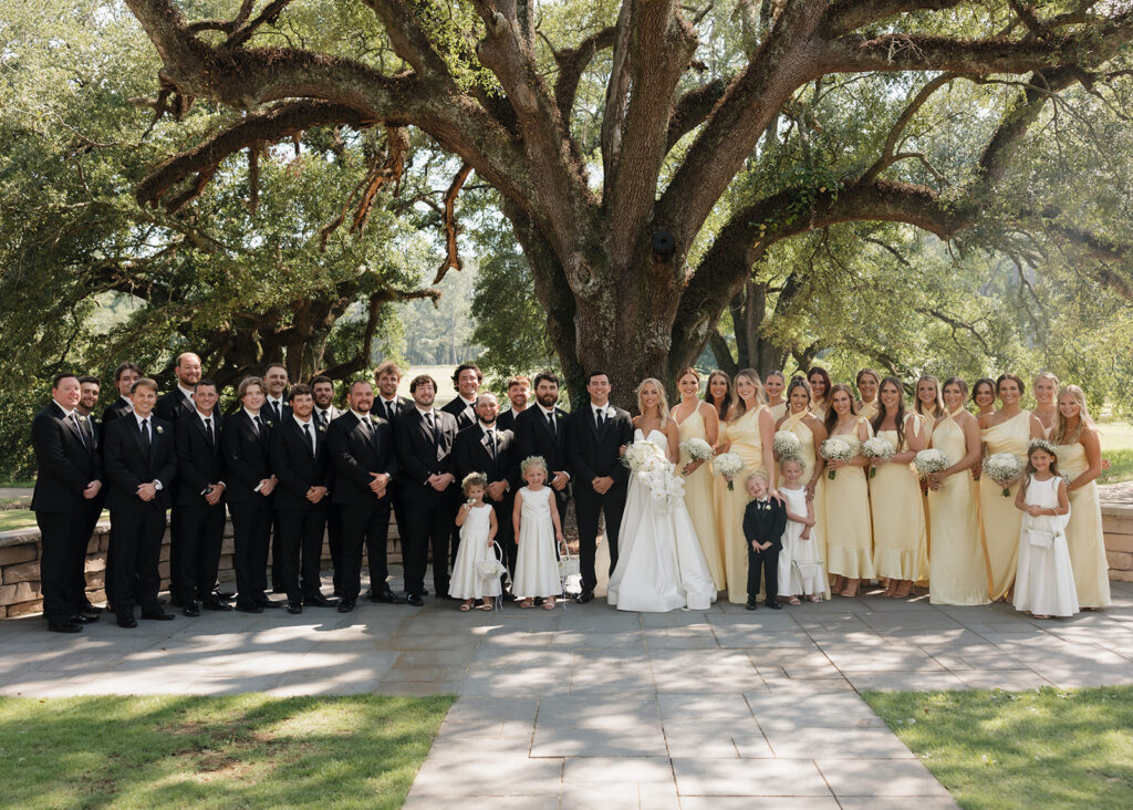 wedding party smiles at the Reed House in Jackson, MS