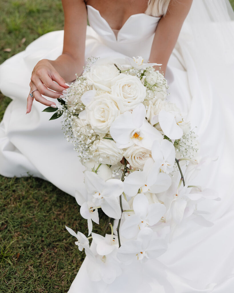 bride plays with her bouquet