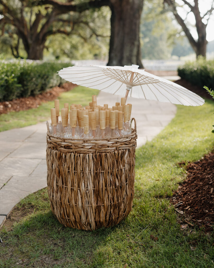 bucket with white parasols in it