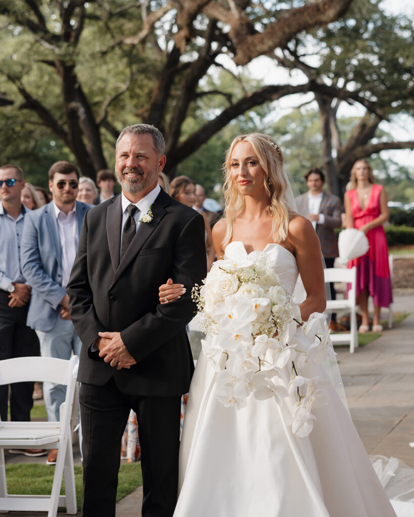 bride walks down the aisle at the Reed House in Jackson, MS