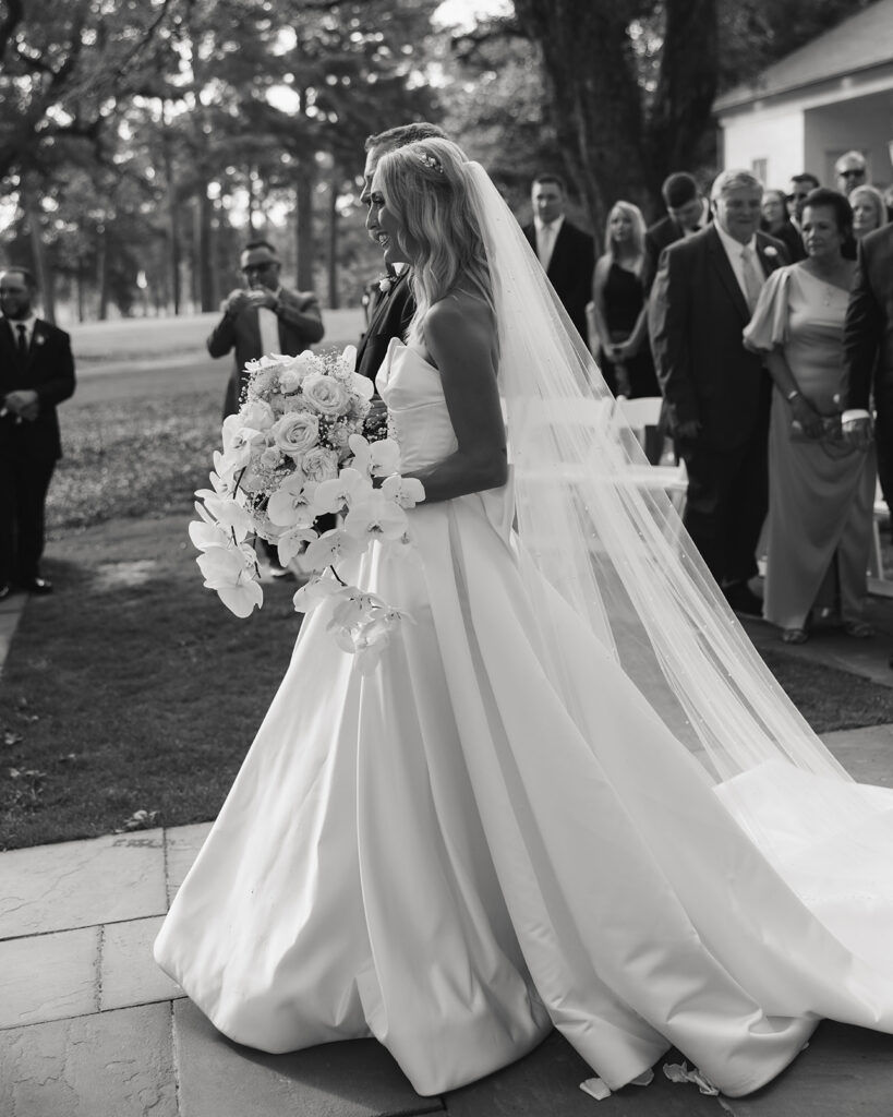 bride walks down the aisle at the Reed House in Jackson, MS