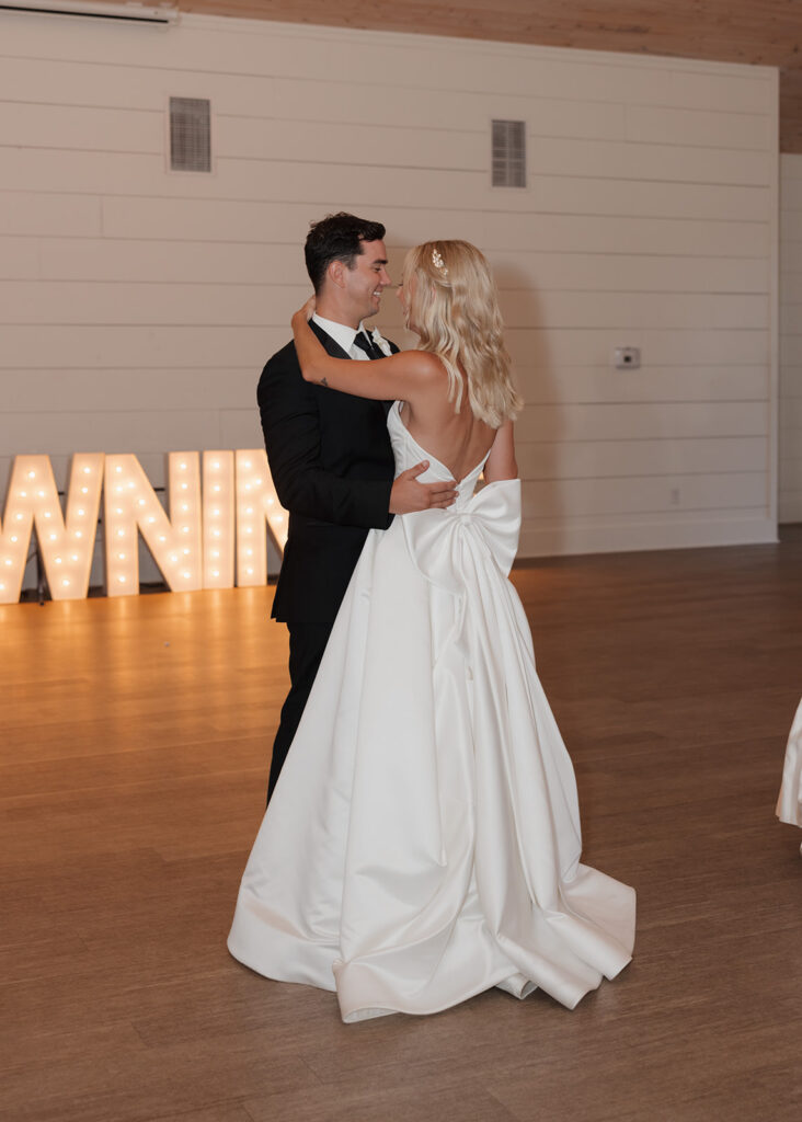 bride and groom share their first dance