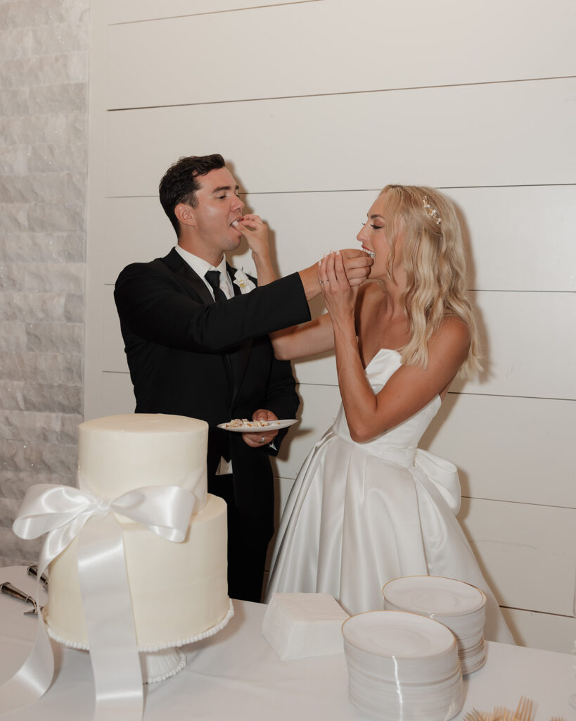 bride and groom cut their wedding cake