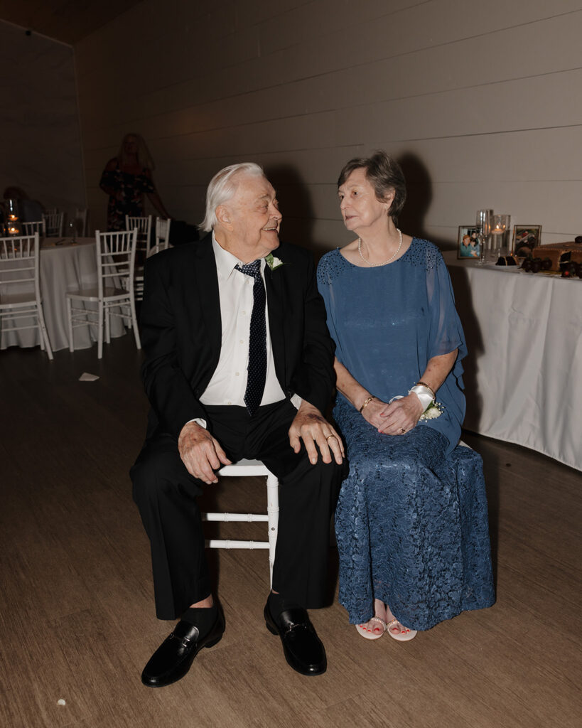 grandparents talk during the wedding reception