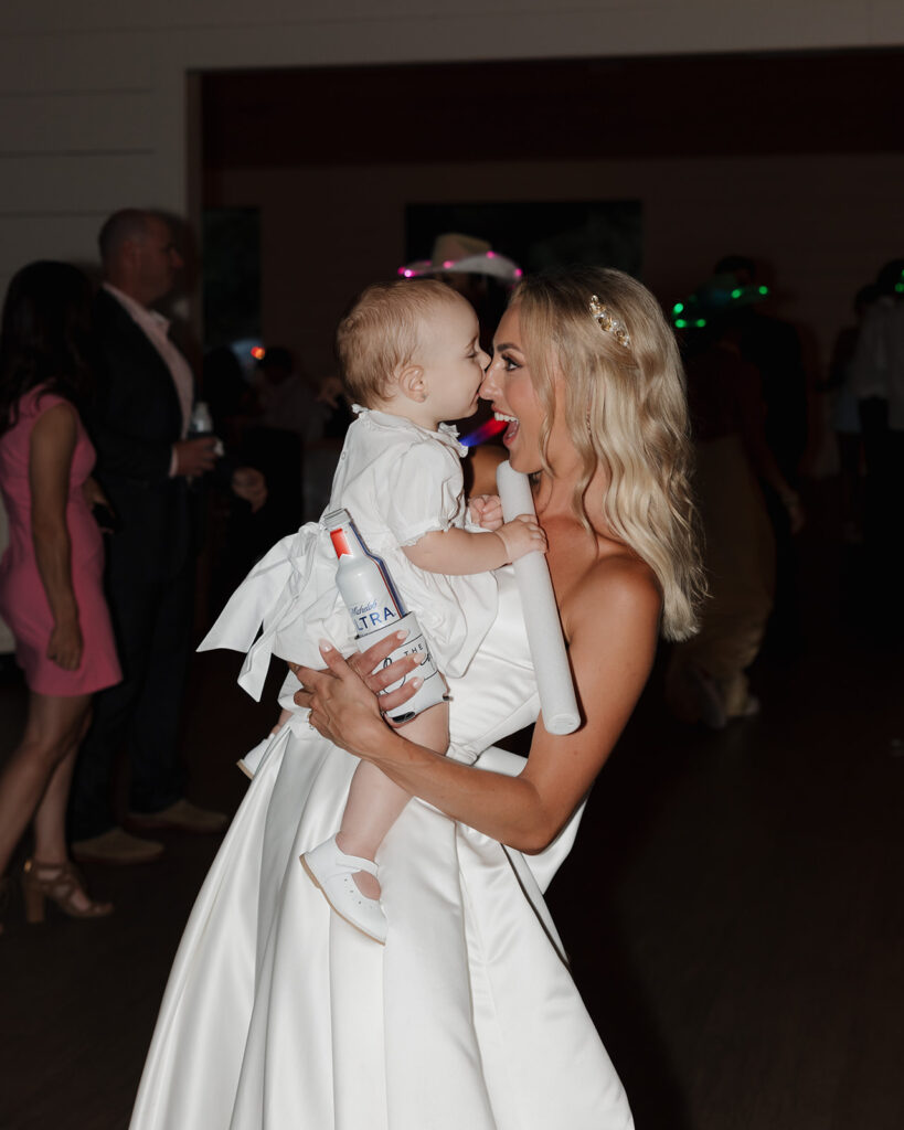 bride holds little girl