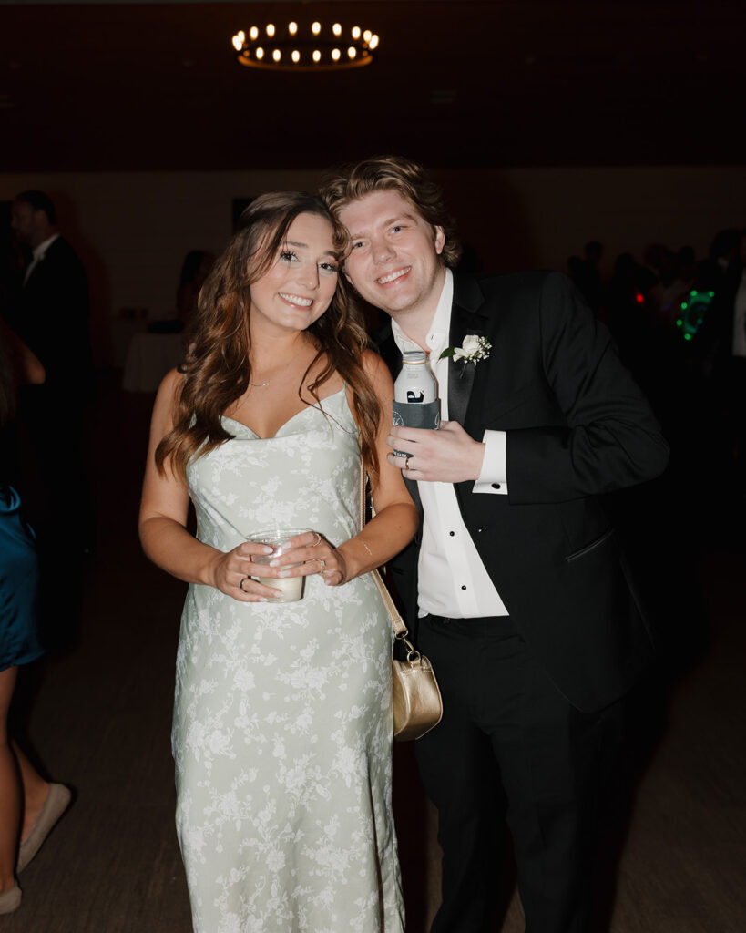 wedding guests smile for a photo