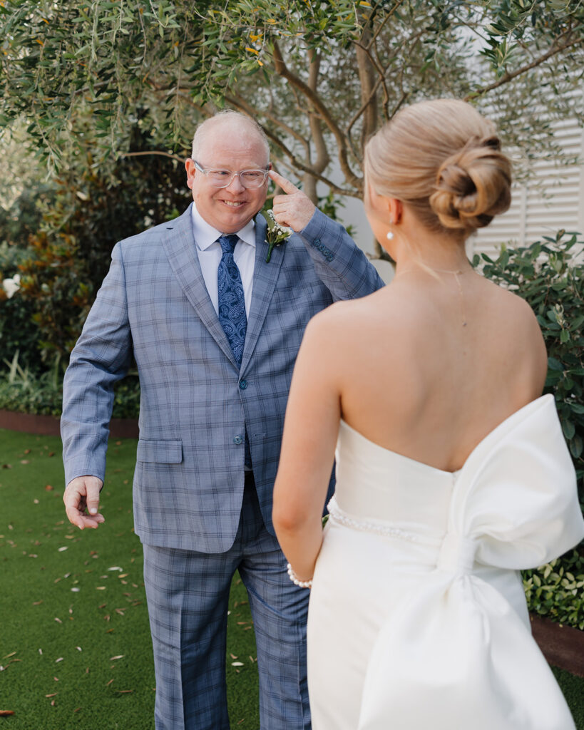 father of the bride reacts to seeing his daughter for the first time in her wedding dress