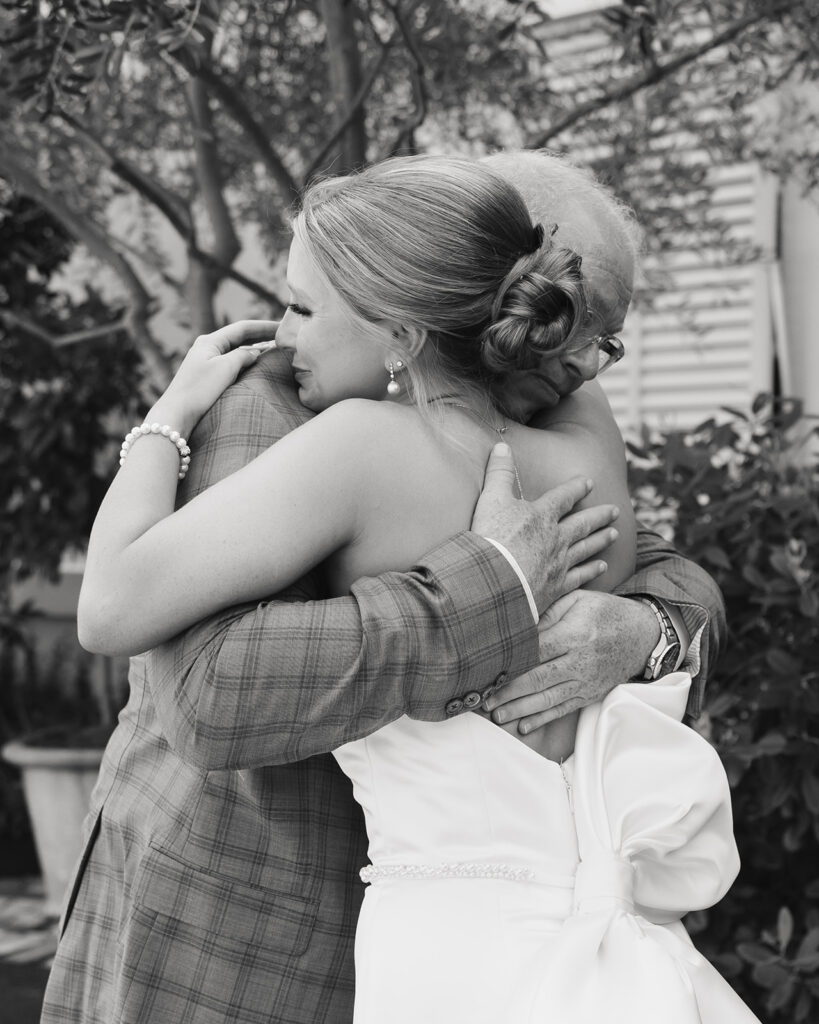 father of the bride reacts to seeing his daughter for the first time in her wedding dress