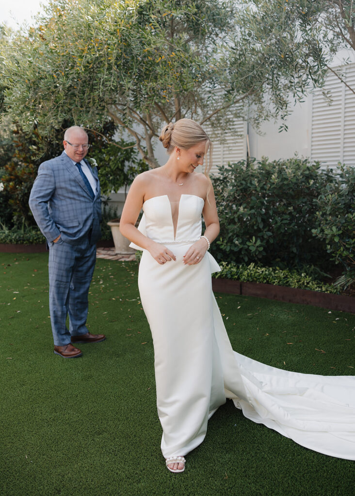 father of the bride reacts to seeing his daughter for the first time in her wedding dress