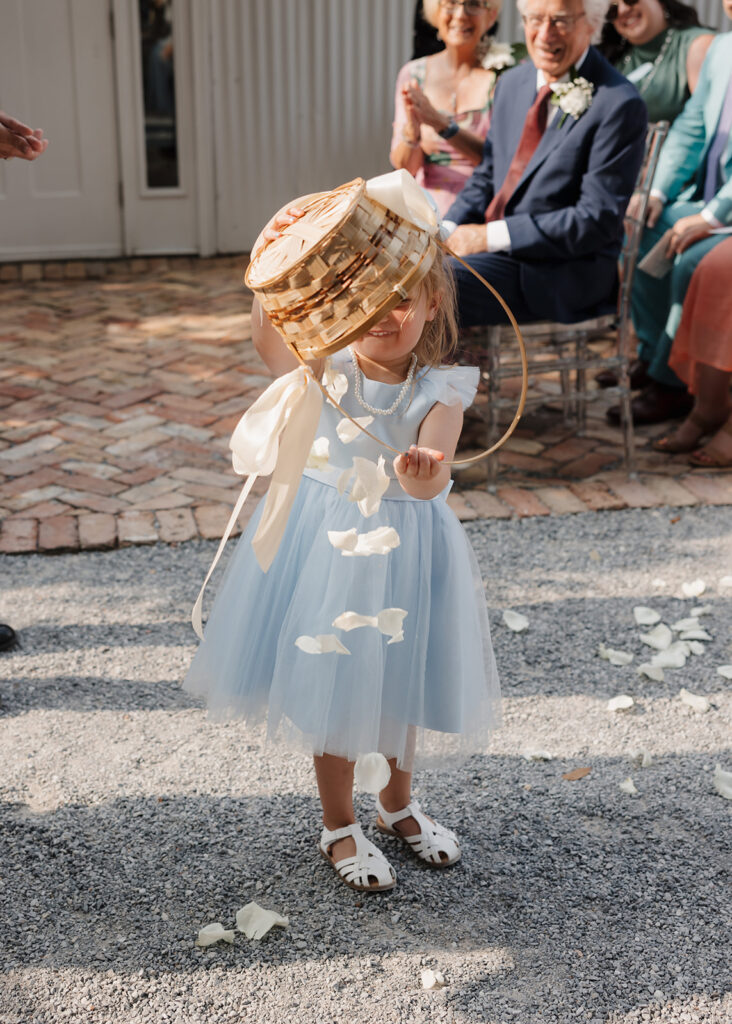 flower girl throws flower petals