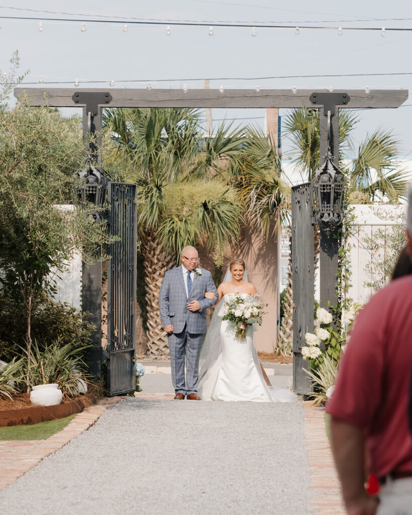 bride and father walk down the aisle