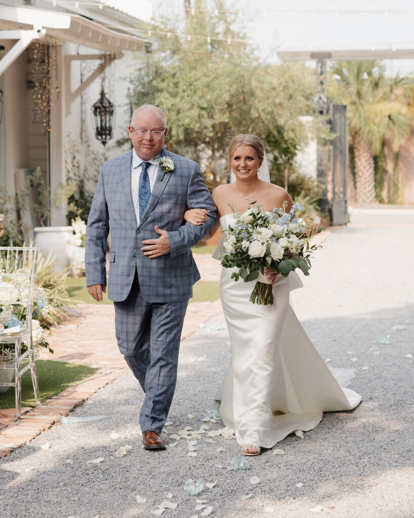 bride and father walk down the aisle