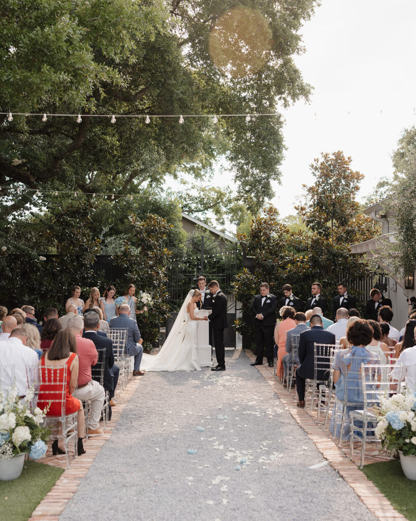 bride and groom pray during wedding