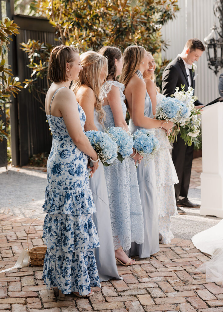 bridesmaids stand during the ceremony