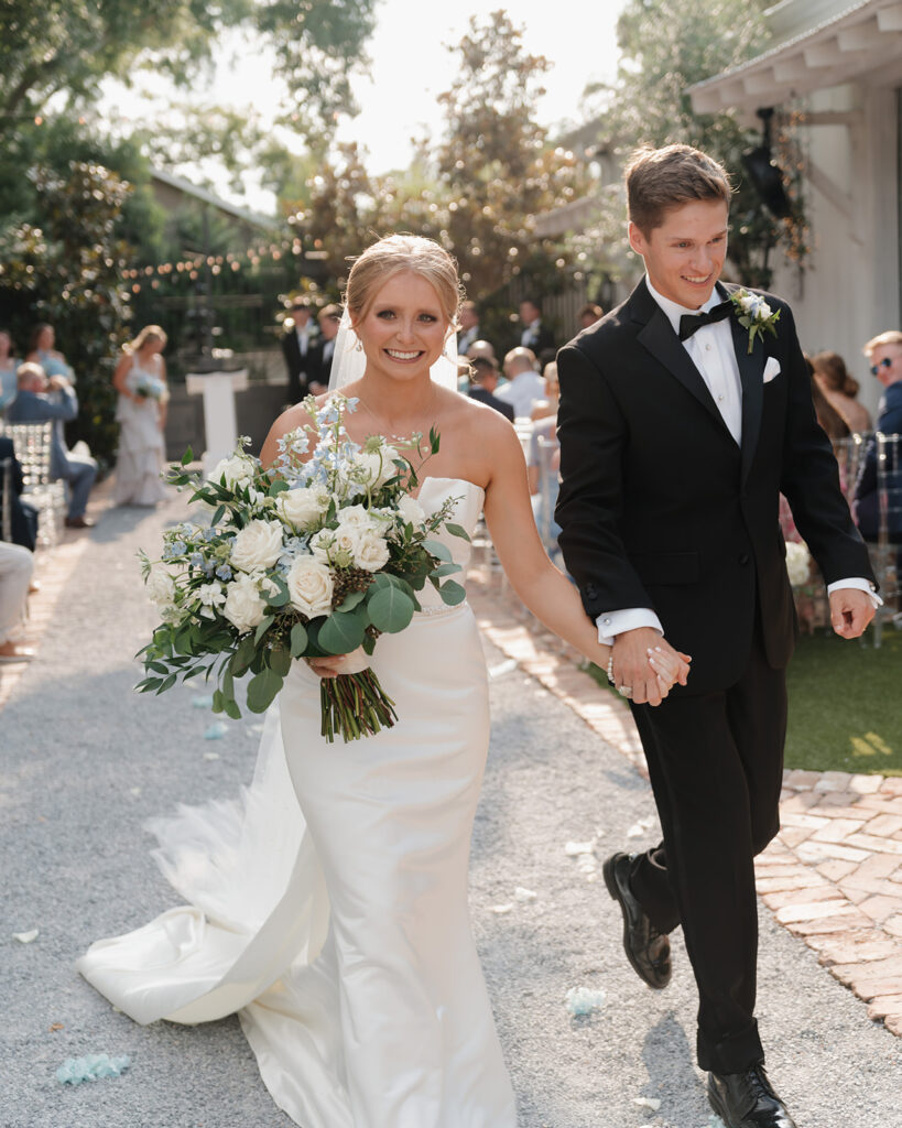 bride and groom cheer after their ceremony