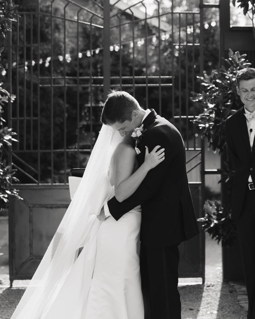 bride and groom hug