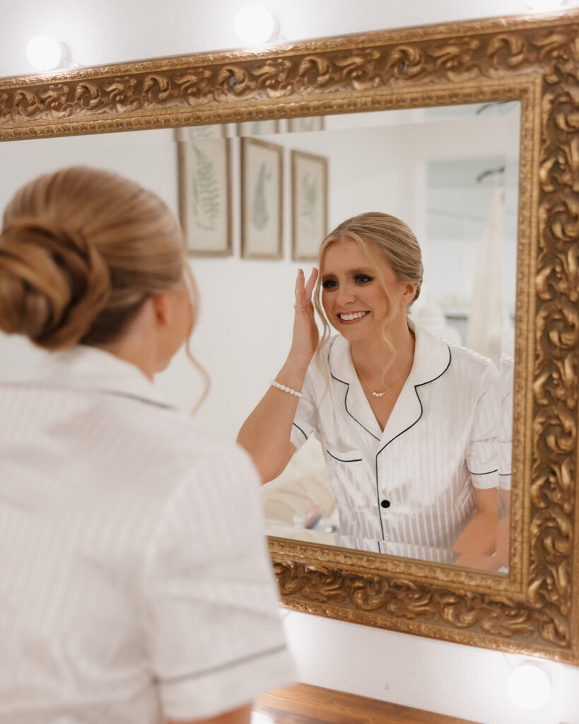 bride adjusts her hair