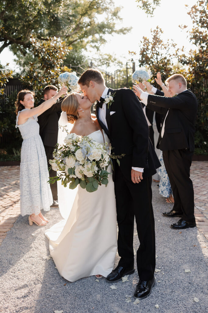 bride and groom kiss