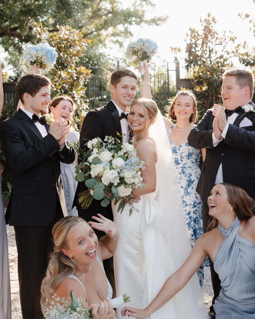 bride, groom, and bridal party cheer