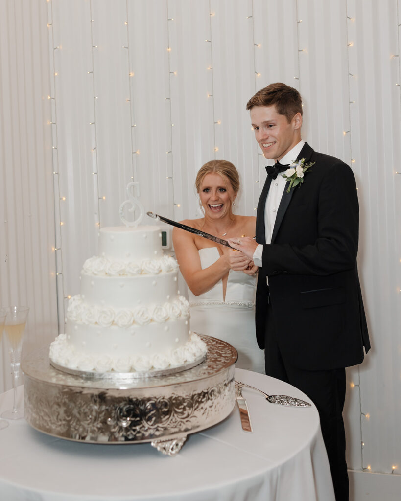 bride and groom cut their wedding cake