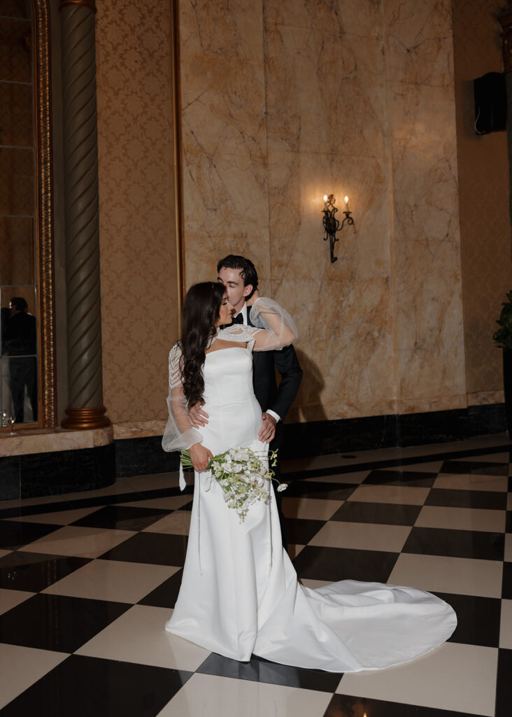 bride and groom kiss