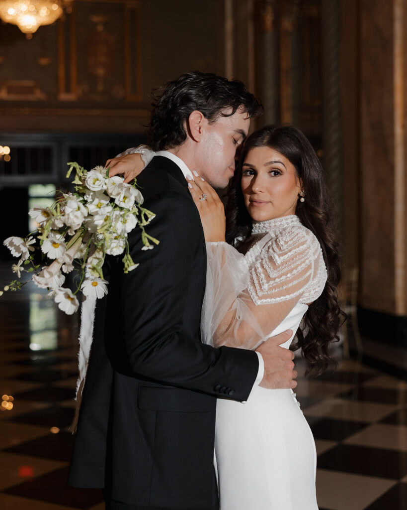 groom whispers in bride's ear