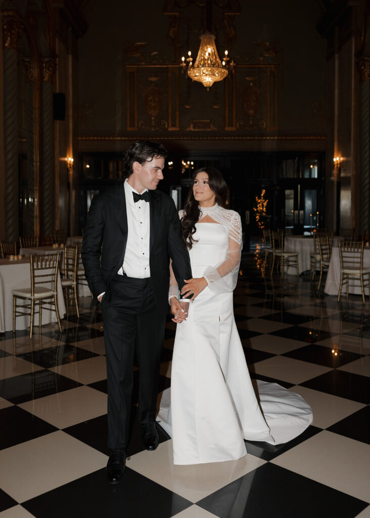 bride and groom walk through their New York wedding venue