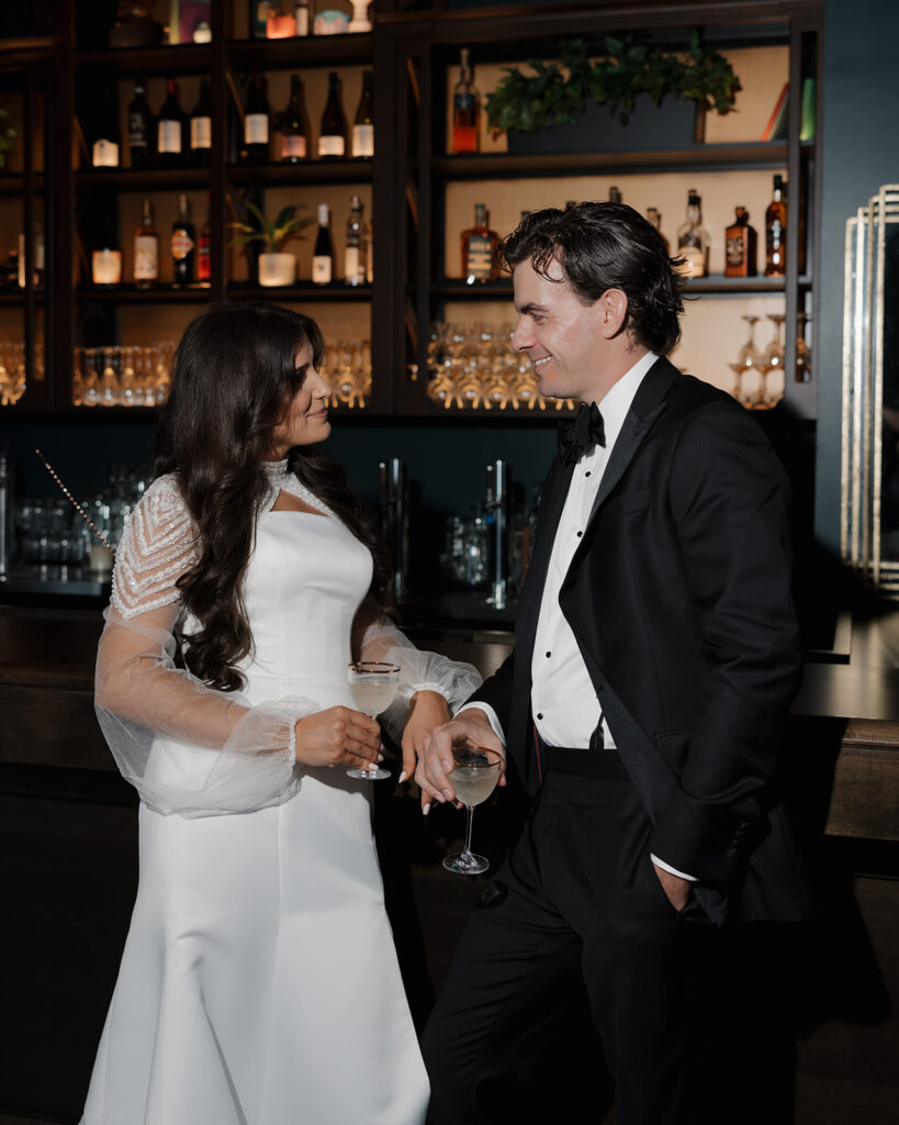 bride and groom chat at their welcome dinner in New York City