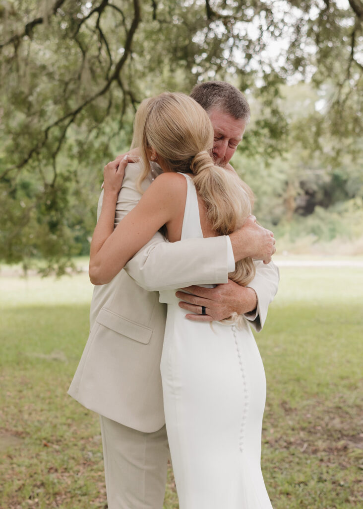 dad hugs bride