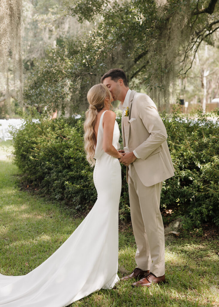 groom and bride kiss