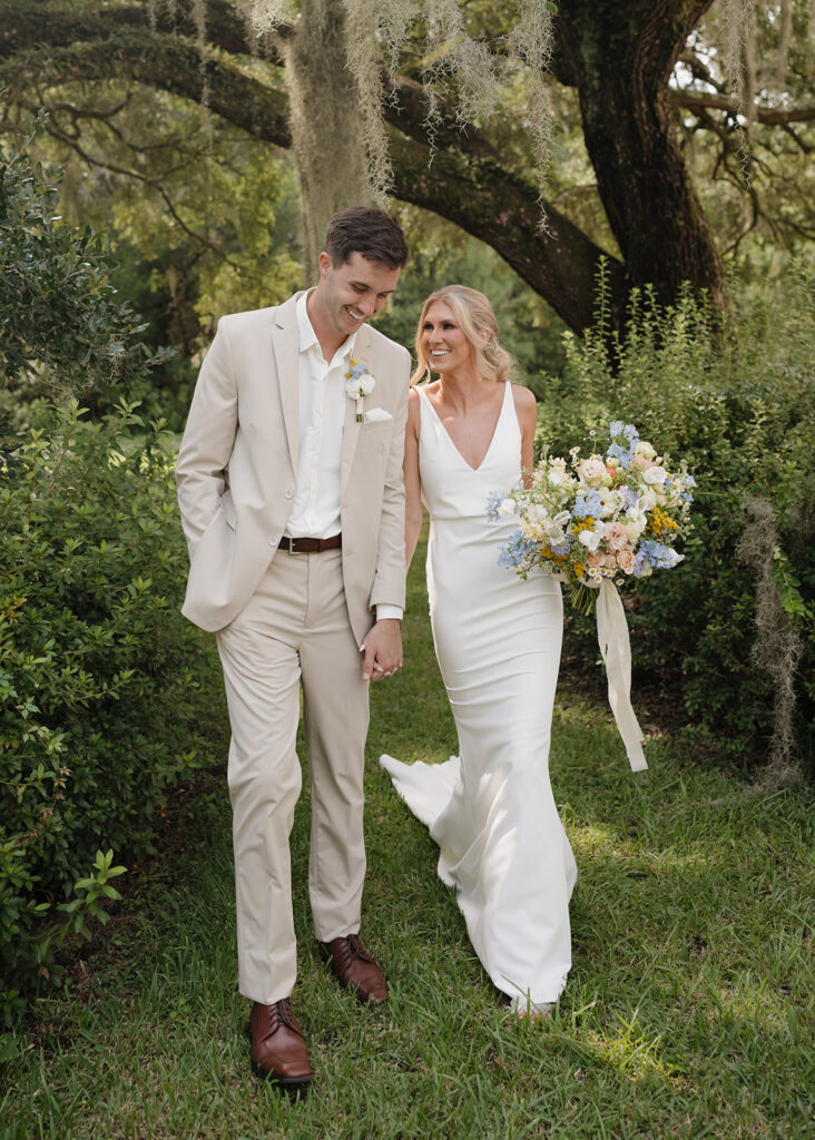 bride and groom walk through their venue