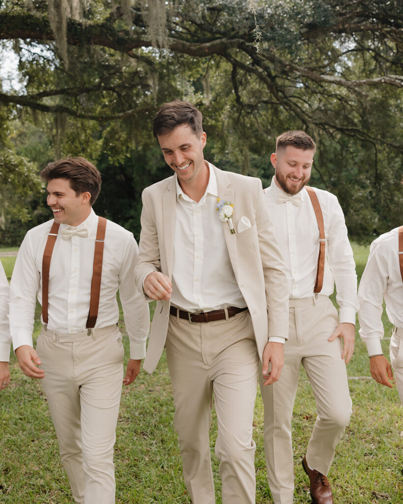 groom and groomsmen laugh