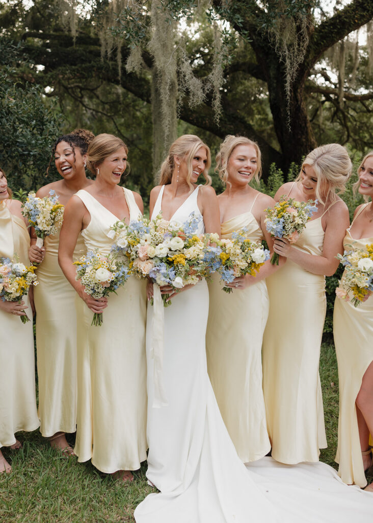 bride and bridesmaids smile