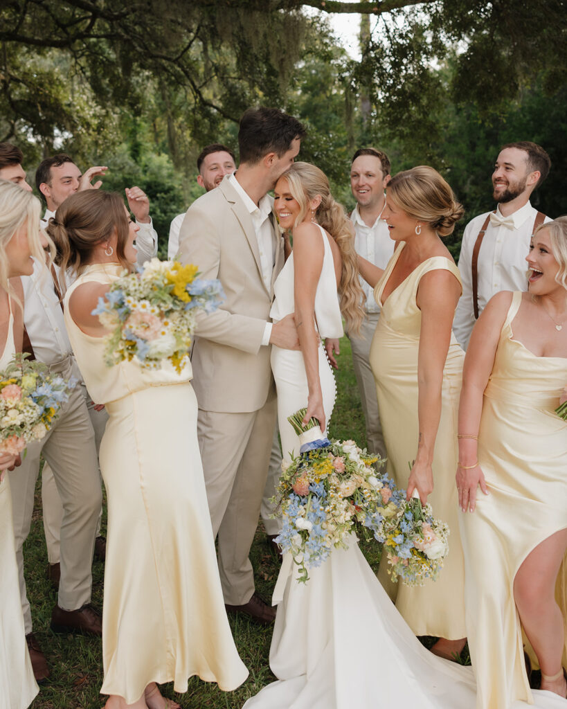 wedding party cheers for the bride and groom