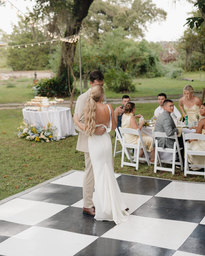 bride and groom share their first dance