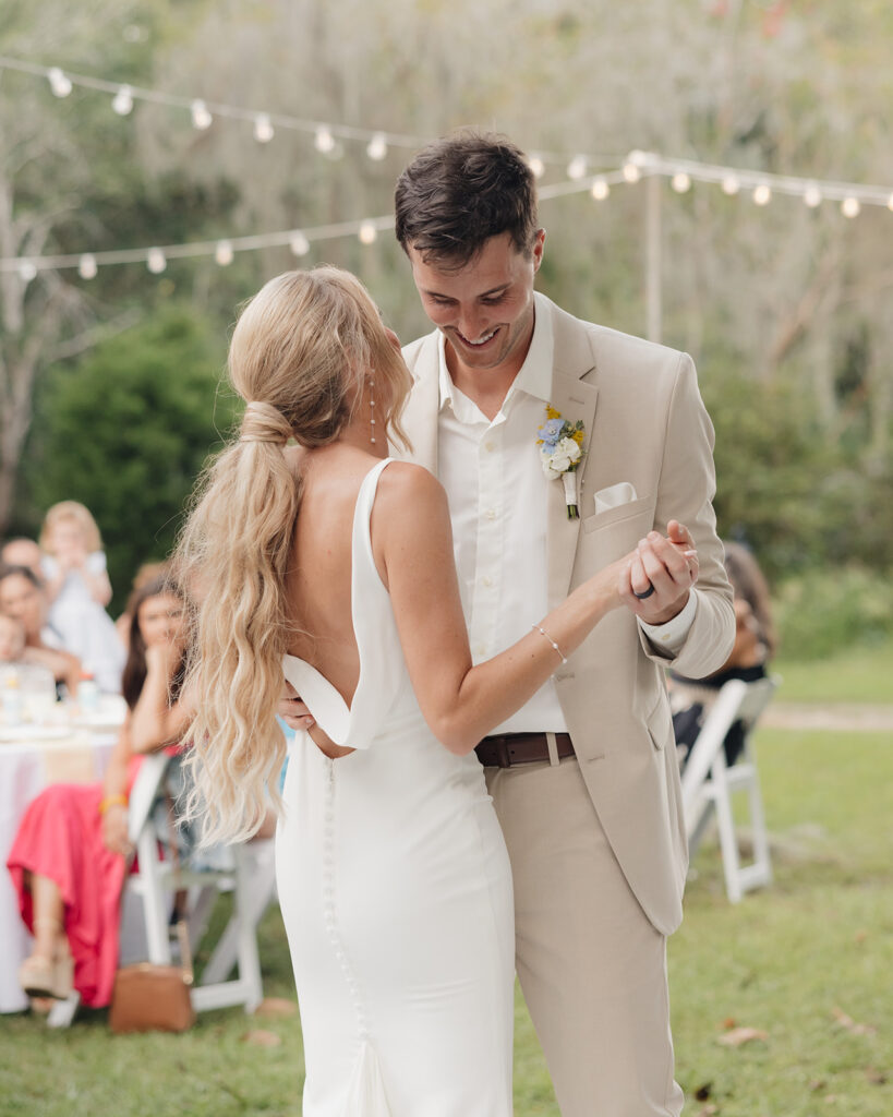 bride and groom share their first dance