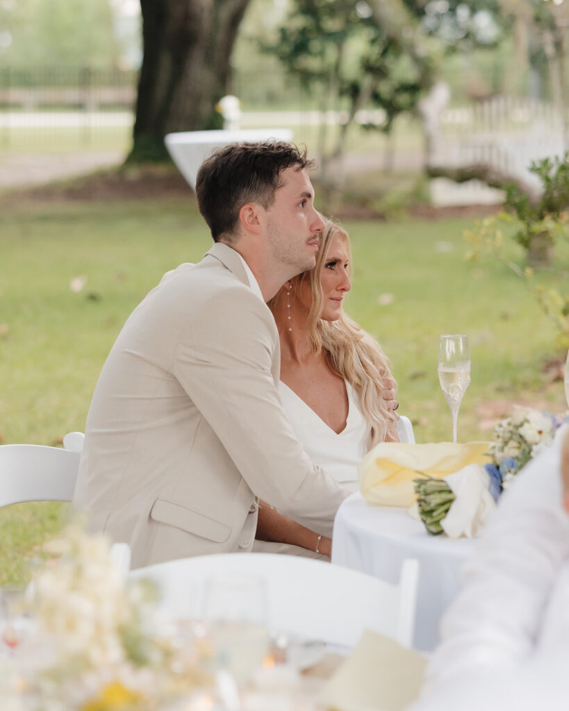 bride and groom cry during a speech