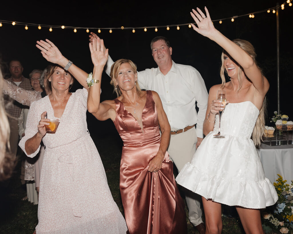 bride and her family dance