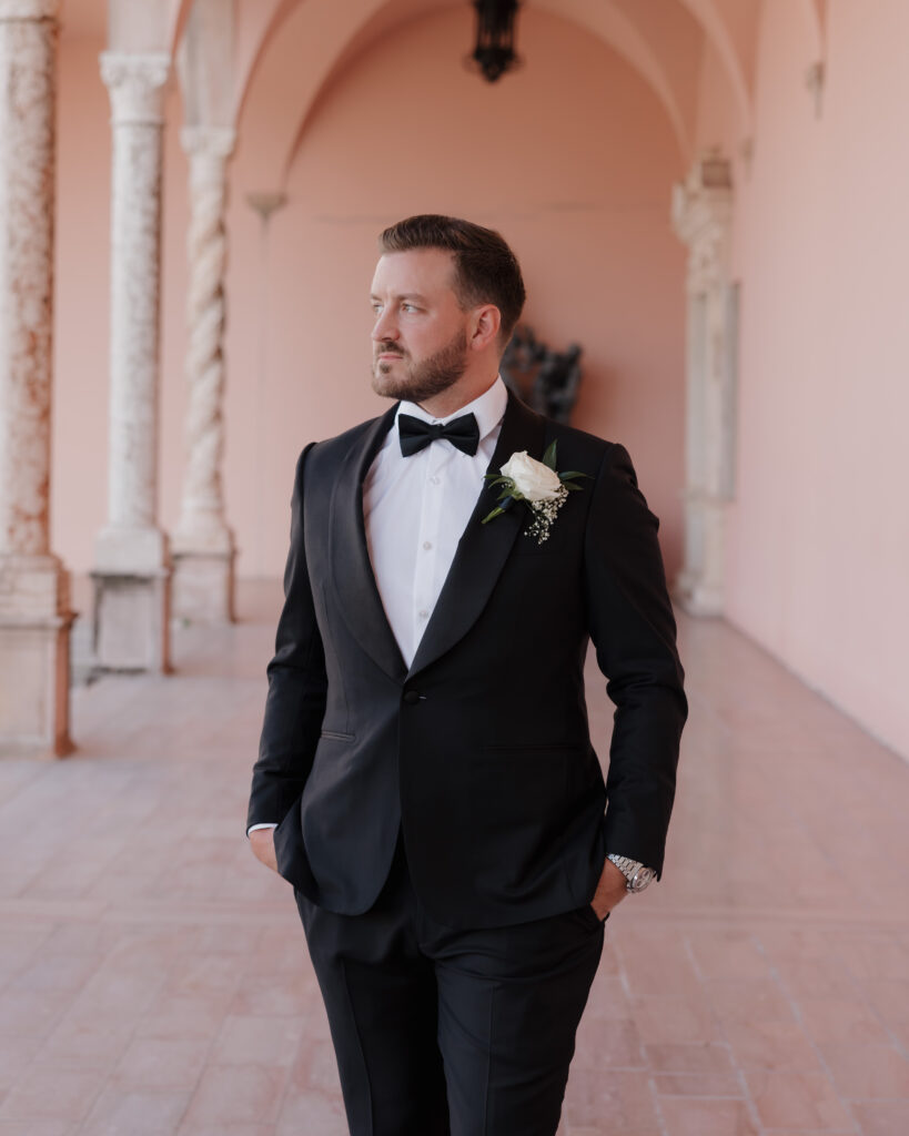 groom looks into the Ringling Courtyard