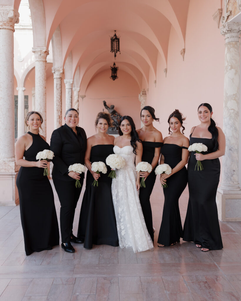 bride and bridesmaids hold their bouquets