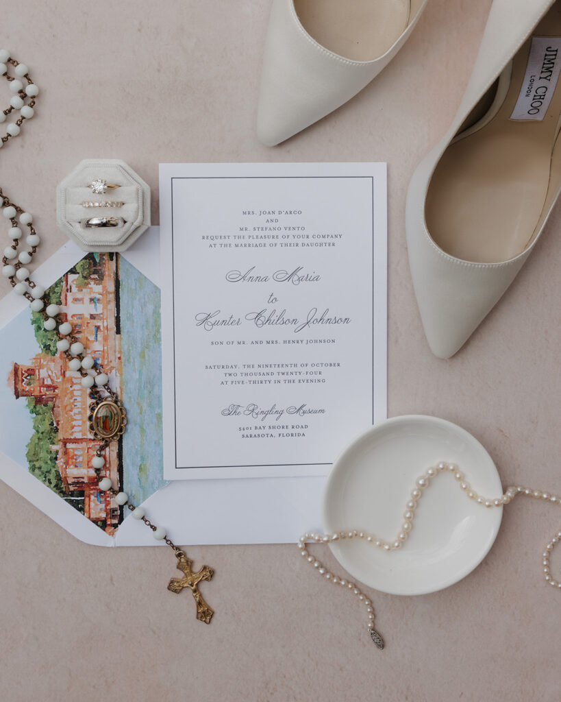 wedding invitation and bride's jewelry