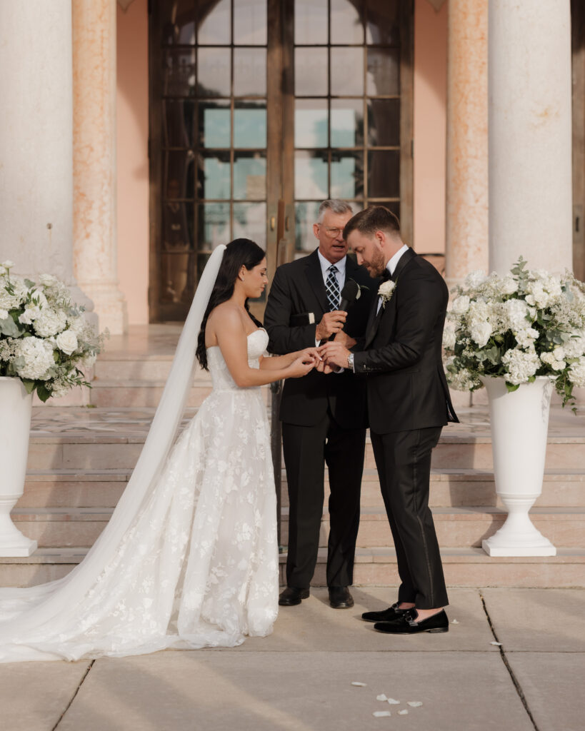 bride and groom exchange rings