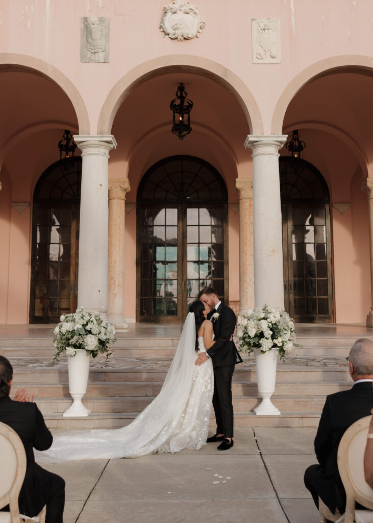 bride and groom kiss