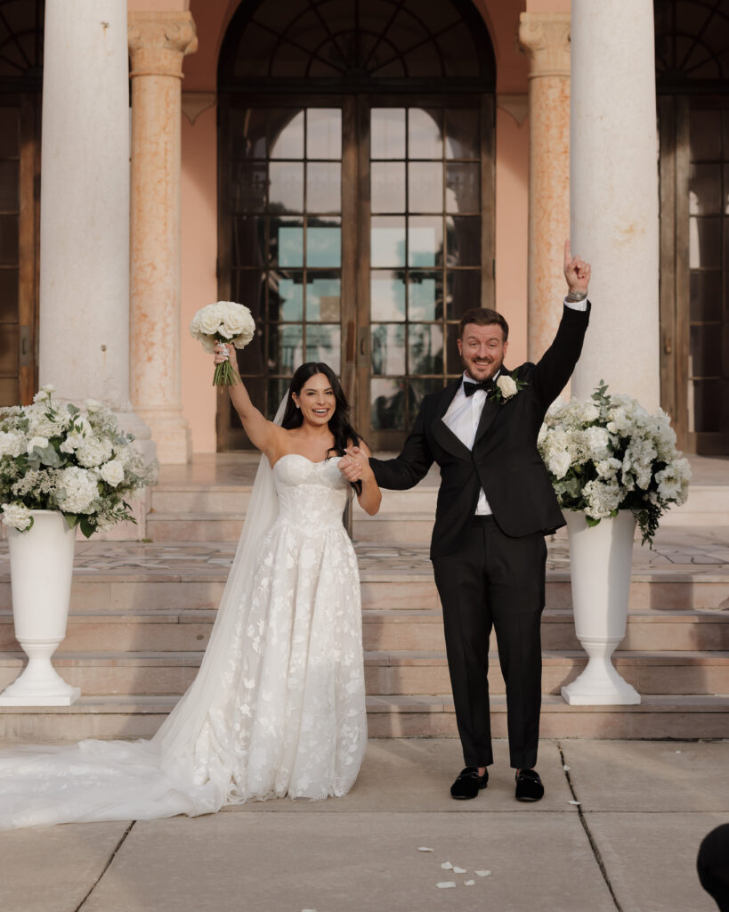 bride and groom cheer