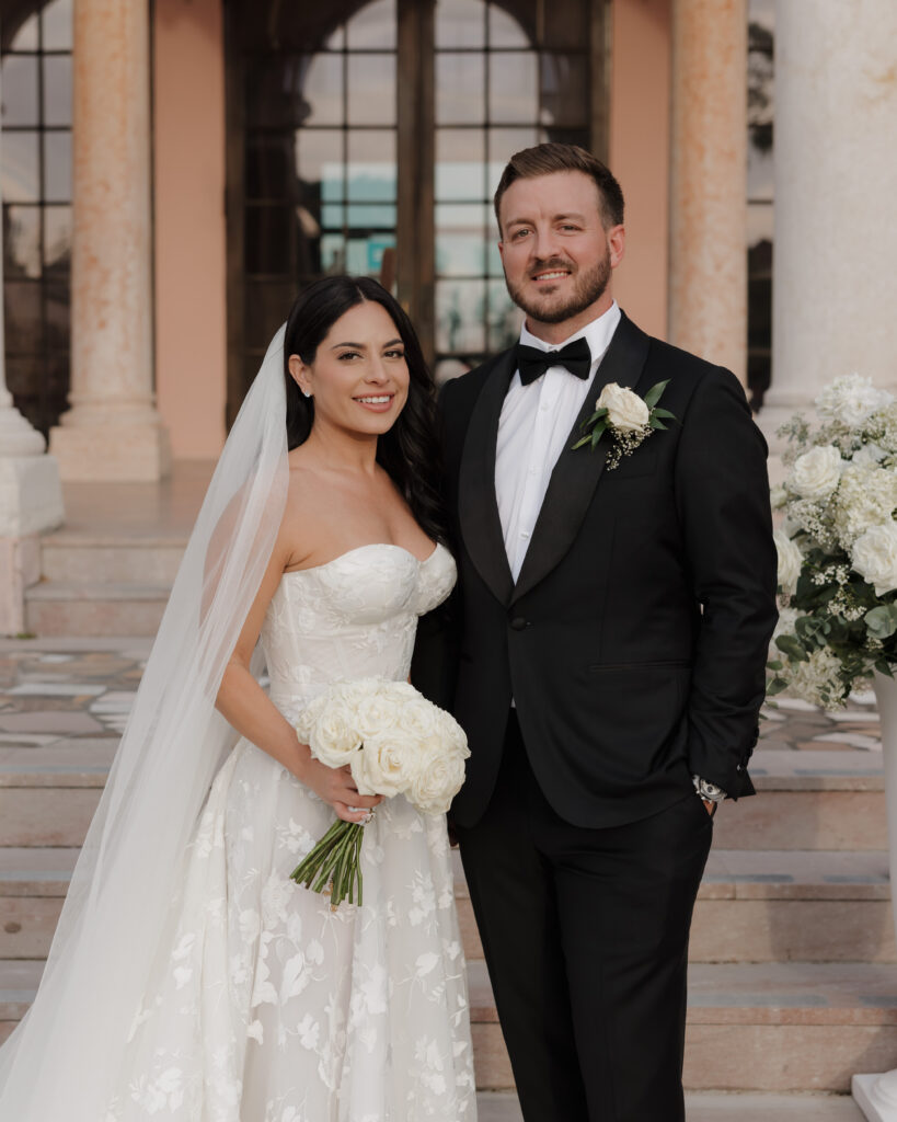 bride and groom smile