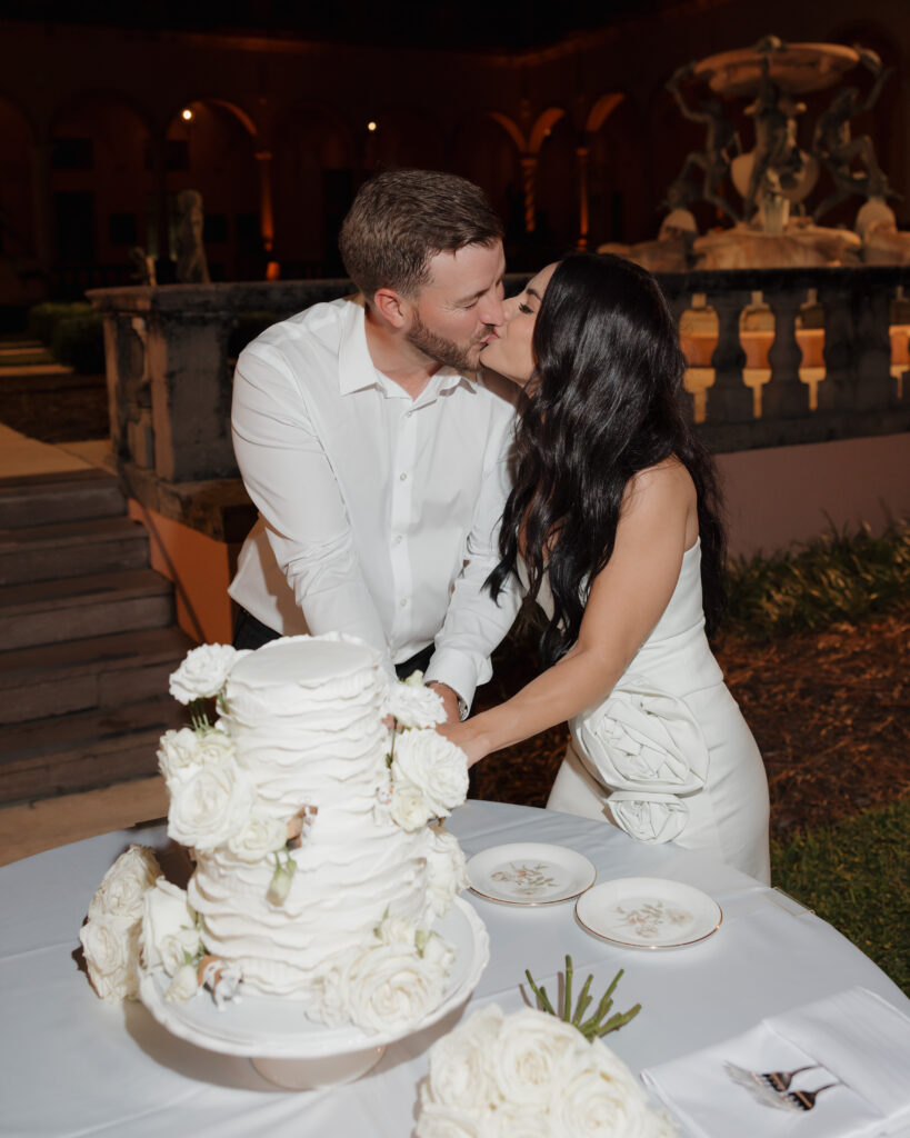 bride and groom cut their cake