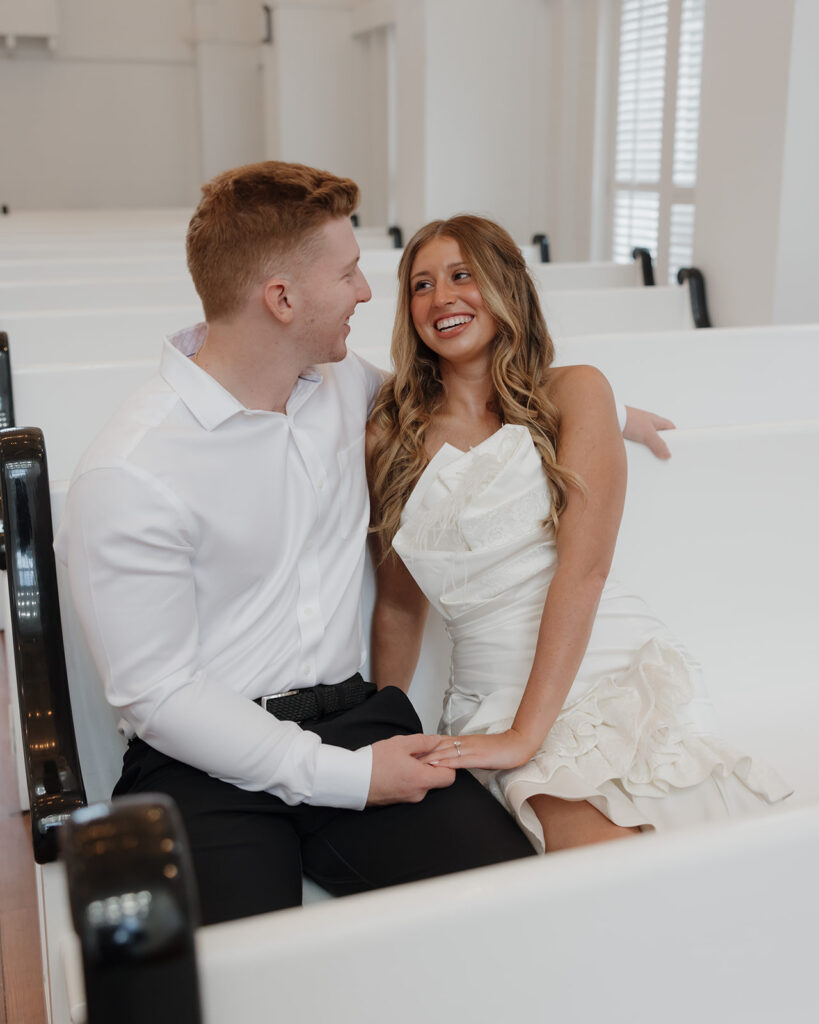 bride and groom laugh at a joke