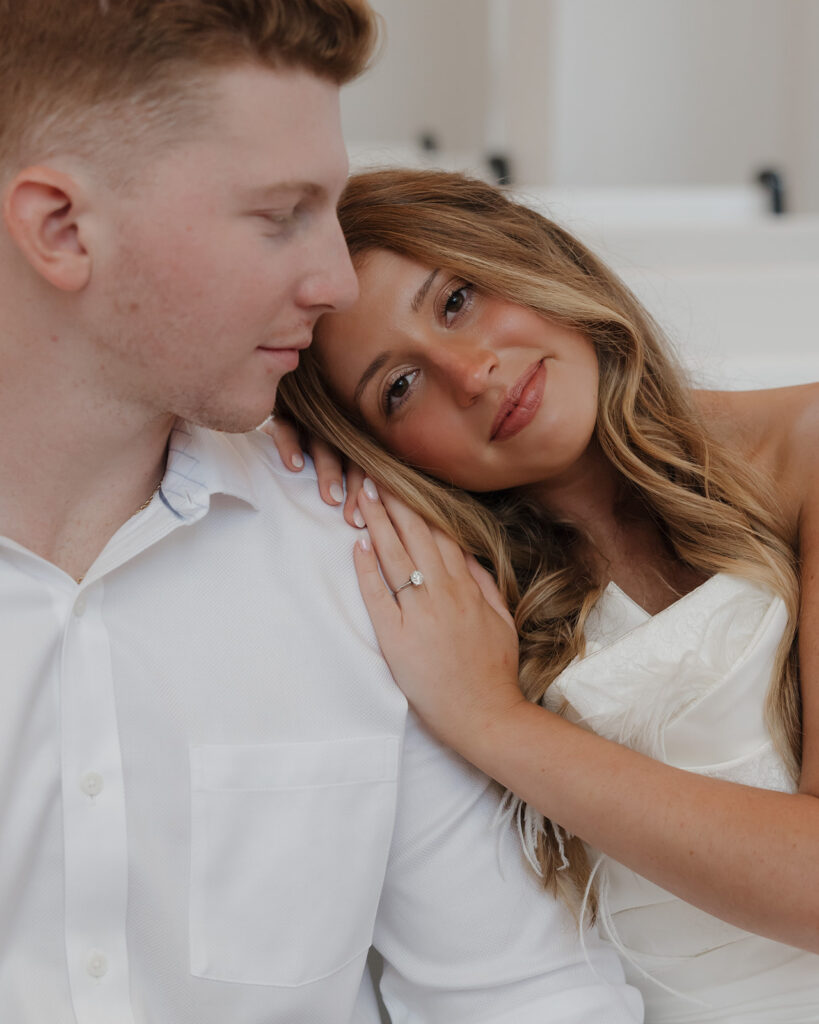 bride leans her head on her groom