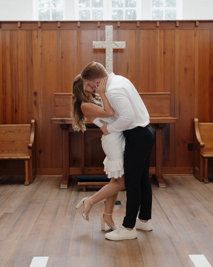 bride and groom kiss at the Seaside Chapel