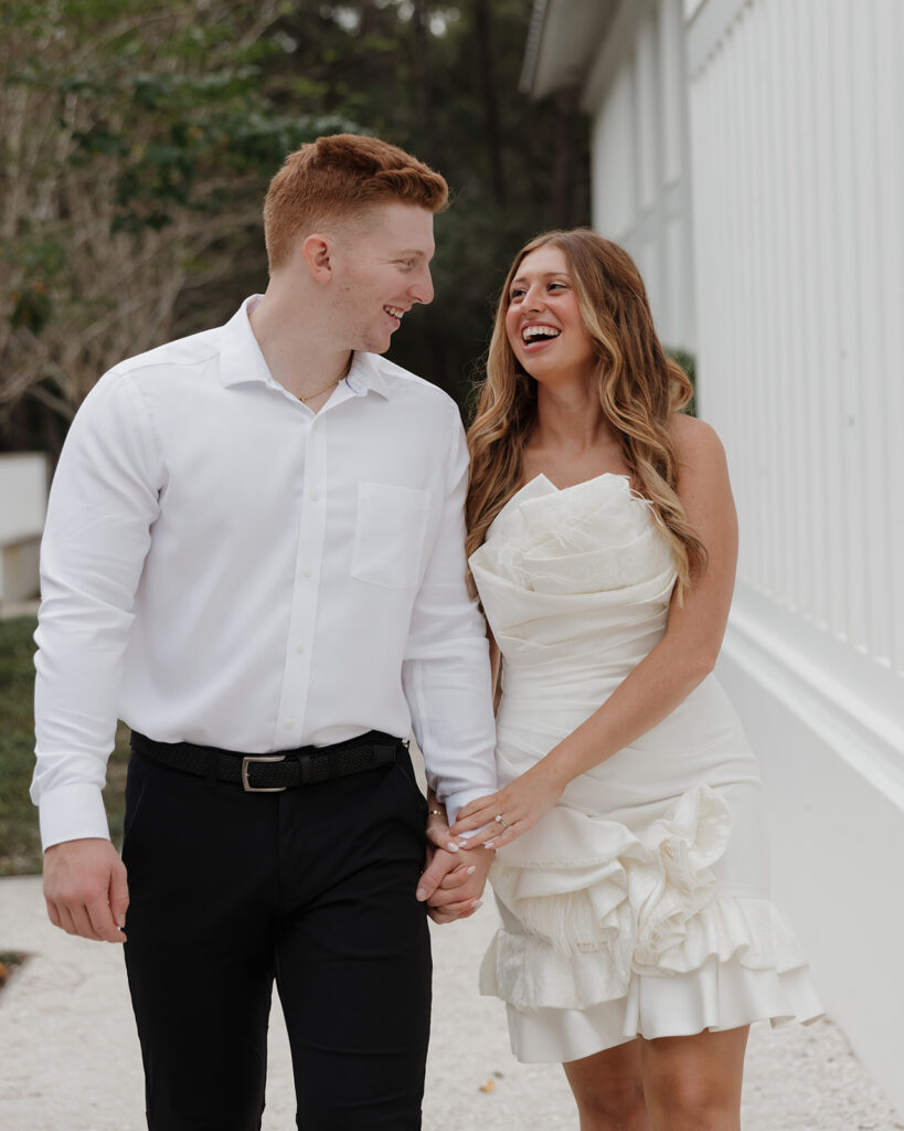 man and woman joyfully laugh